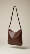Solaine Espresso Crossbody bag in leather, front view on neutral background